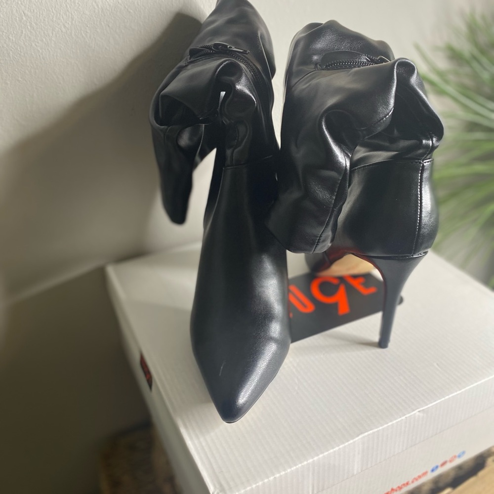 Black leather calf length boots